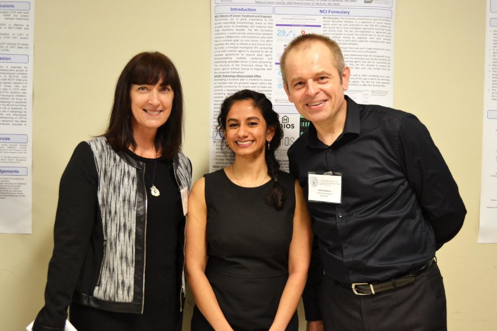A biotechnology student with her mentors at the Biotechnology Poster Presentation